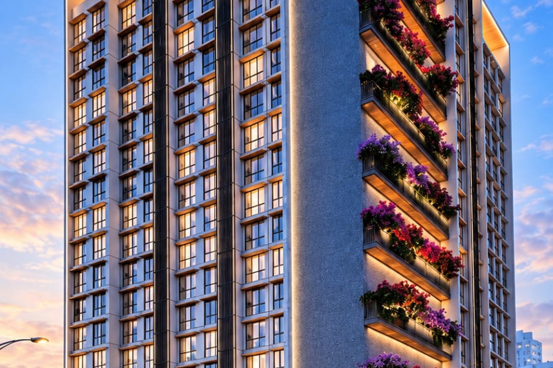 The Shreedhi facade at dusk with planted balconies